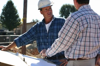 Contractor talking with home owner about Radon Mitigation systems