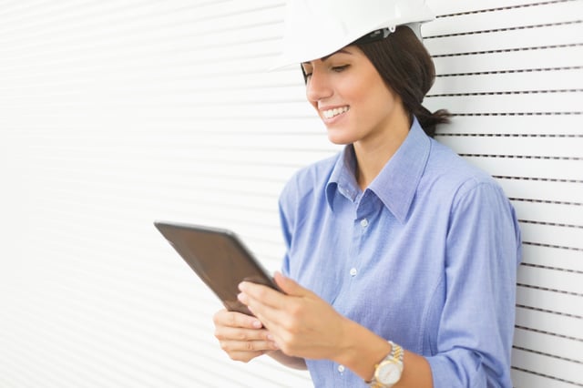 Woman Contractor Planning Radon Mitigation