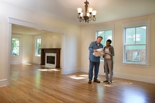 Homeowner Discussing Radon Mitigation and Testing with Contractor