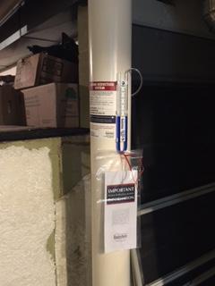 Licensed Radon Mitigation Specialist performing an inspection in Painesville
